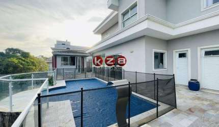 Casa de luxo no Condomínio Terras de Santa Teresa em Vinhedo, com 4 suítes, 3 salas e 350m² de área privativa. Venha conferir!