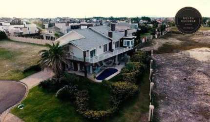 Casa Condominio para Venda - 550m², 7 dormitórios, sendo 7 suites, 4 vagas - Centro de Xangrilá
