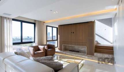 excelente apartamento duplex , com 130m² ,finamente mobiliado  com otima  vista . hall de entrada , lavabo , living  com persianas automatizadas , lareira a gás,sistema de som e imagem ,estofado com s