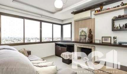 Apartamento  em andar alto com lareira e churrasueira. Este apartamento possui 3 dormitórios, incluindo uma suíte, 2 vagas de garagem e uma área privativa de 75m². Além disso, o prédio oferece uma inf