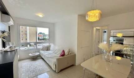 Excelente apartamento 2 dormitórios, sendo 1 suíte. Com planta de 68 m² pronto para morar. O living é bem iluminado e confortável, integrado a cozinha americana já com móveis planejados e churrasqueir