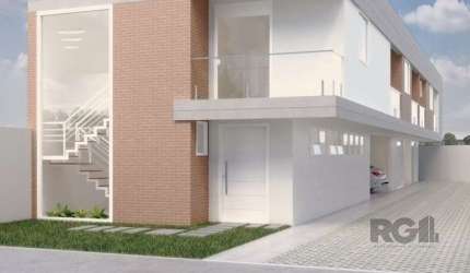 Casa à venda no Condomínio Fênix II, localizada na Rua Manauê, Vila Assunção, Porto Alegre. Possui área privativa de 238m² e área total de 272m². Primeiro pavimento composto de jardim, pátio (que pode
