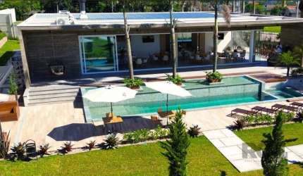 Terrenos em Canoas, condomínio clube com 142 lotes a partir de 191m². Possui infra completa com piscina, lounge gourmet, fire pace, academia, quadra de beach tênis, play ground, play kids, segurança 2