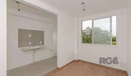 Apartamento 2 dormitórios,  living 2 ambientes, área serviço separada, cozinha americana com churrasqueira, laminado pronto para morar, prédio semi novo, com portaria, salão festas, quadra de esportes