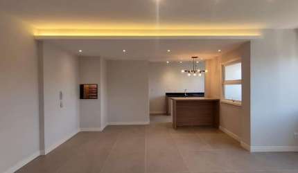 Apartamento medindo 76,60 m²,  2 dormitórios, living para dois ambientes com churrasqueira, cozinha com móveis sob medida, banheiro social, lavabo, área de serviço com tanque e vaga de garagem escritu