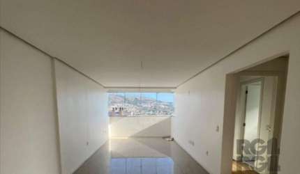 Apartamento 79,85 privativos, frente, 2 dormitórios (1 suíte), living para 2 ambientes, churrasqueira, banheiro social com ventilação natural, cozinha americana e área de serviços. 2 vaga de garagem s