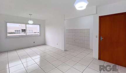 Descubra seu novo lar em Canoas! Apresentamos este encantador apartamento de 62 metros quadrados, localizado na Rua Doutor Alfredo Angelo Filho, no bairro Igara, em Canoas. Este espaçoso imóvel desocu