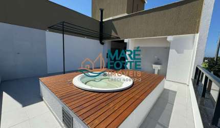 Cobertura próximo a praia com vista lateral para o mar