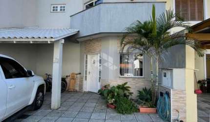 Casa em condomínio fechado com 3 quartos à venda na Rua Deputado Hugo Mardini, 1780, Passo das Pedras, Porto Alegre, 140 m2 por R$ 680.000