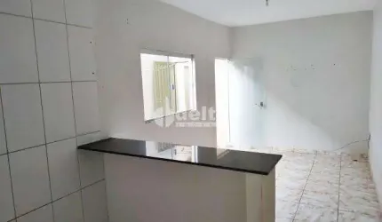 Casa residencial disponível para venda no bairro Jardim Canaã em Uberlândia-MG
