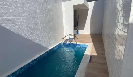 BELÍSSIMA CASA SOBREPOSTA BAIXA COM FINO ACABAMENTO - APARECIDA- 150M²- 3 SUÍTES, ESPAÇO GOURMET COM CHURRASQUEIRA – PISCINA - DUAS VAGAS