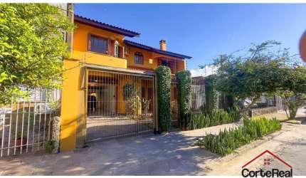 Casa com 4 quartos à venda na Rua Coronel Jaime da Costa Pereira, 340, Partenon, Porto Alegre por R$ 1.090.000