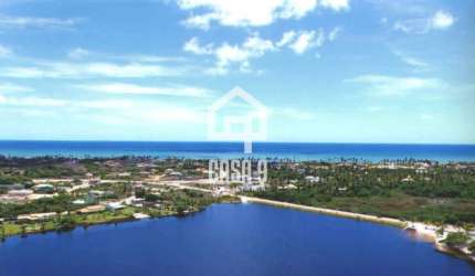 Terreno plano com 827 m² a venda fundo de lagoa no condomínio Águas de Sauipe em Porto de Sauipe Bahia