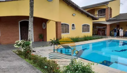 Casa com 4 suítes piscina churrasqueira 6 vagas na Praia Suarão - Itanhaém