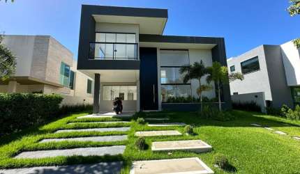 Casa a venda em alphaville litoral norte 1 com 4 suites piscina e área gourmet