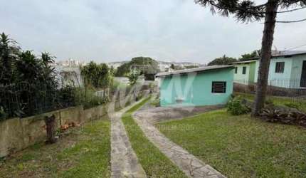 TÉRRENO COM 390M² COM 3 CASAS PEQUENAS EXECELENTE PARA INVESTIMENTO. AGENDE SUA VISITA E VENHA CONHECER. F: 51 98410.2913