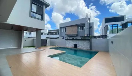 Casa alto padrão com 4 suítes e 4 vagas de garagem em condomínio fechado