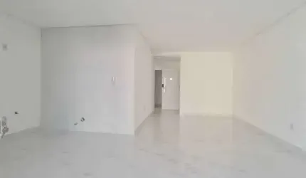 Apartamento com 3 suítes e 2 vagas de garagem na Praia central em Itapema