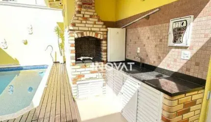 Casa com 3 dormitórios à venda, 157 m² por R$ 1.150.000,00 - Caiçara - Praia Grande/SP