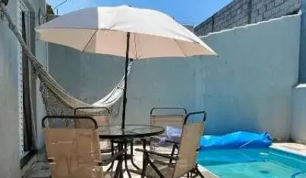 Casa a venda semibiliada , com 3 dormitórios sendo 1 suíte, Cozinha , sala, 02 banheiros ,Jardim de Inverno Área gourmet com Piscina e Churrasqueira