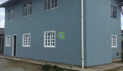 Casa comercial a venda bairro Ponte do Imaruim, em Palhoça, conta com 4 apartame
