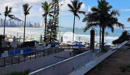 PRÉDIO FRENTE AO MAR NA ASTÚRIAS, APARTAMENTO COM 4 SUÍTES, 2 VAGAS PARA AUTO.