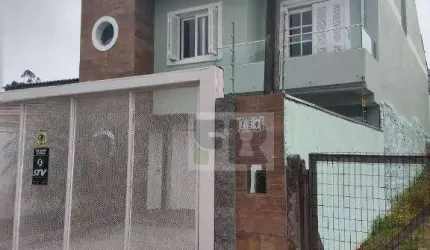 Ótimo sobrado com 3 dormitórios sendo 2 suítes á venda no bairro Moradas do Bosque em Cachoeirinha RS.