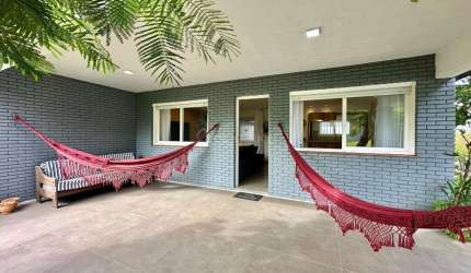 Casa em condomínio fechado com 4 quartos à venda na Rua Inambuí, 351, Atlântida, Xangri-Lá por R$ 1.200.000