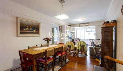 Apartamento com  73m², 2 dormitórios,  área de serviço separada, living 2 ambientes , vaga de garagem escriturada e coberta.