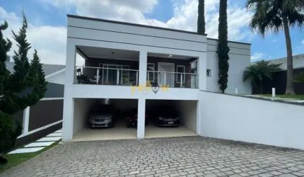 Casa de luxo em condomínio fechado em Arujá com 4 suítes e 5 banheiros por R$ 4.5 milhões