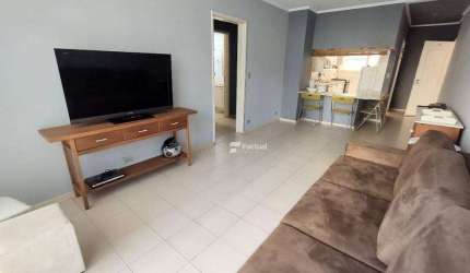 Frente mar, 2 dormitórios à venda, 110 m² por R$ 500.000 - Pitangueiras - Guarujá/SP