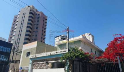 Terreno com 3 casas em Santana