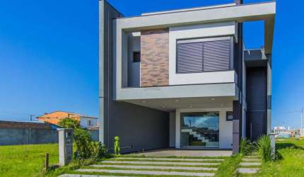 vende sobrado novo em condomínio com 3 suítes em Canoas.