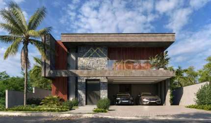 Casa com arquitetura e acabamentos de alto padrão com 4 suítes em condomínio fechado