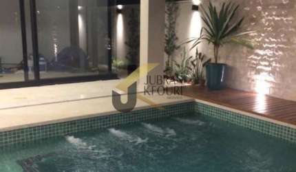 Casa à venda em condomínio de Hortolândia, 4 suítes, piscina e 4 garagens