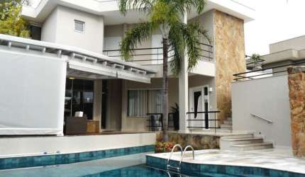 Casa à venda no Alphaville Campinas, 4 suítes (1 master com varanda), piscina e espaço gourmet