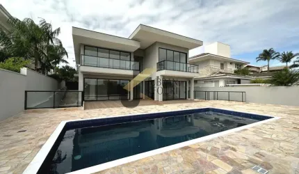 Casa para aluguel no Alphaville Campinas, com 4 suítes, lazer comum e garagem para vários carros.
