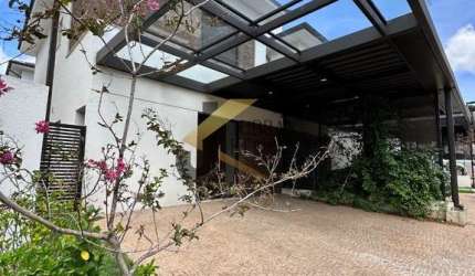 Casa em condomínio à venda no Parque Nova Campinas - Campinas, com 3 suítes, lazer comum e 2 garagens cobertas.