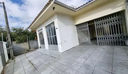 Terreno de 300m² e 3 casas, sendo 1 comercial no Balneário do Estreito