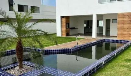 Vendo Casa nova recém construída com 50mm2, piscina privativa, espaço gourmet , área verde, jardim, 4 suítes no condomínio Parque de Jacuípe com Rio e mar para ir andando.