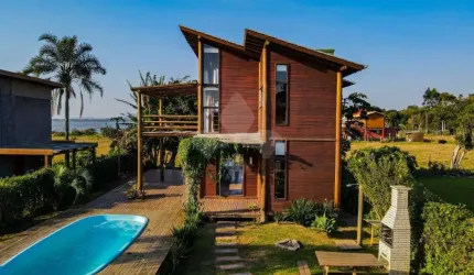 Casa em condomínio fechado com 3 quartos à venda na Manoel Irineu Gonçalves, 1, Ibiraquera, Imbituba por R$ 960.000