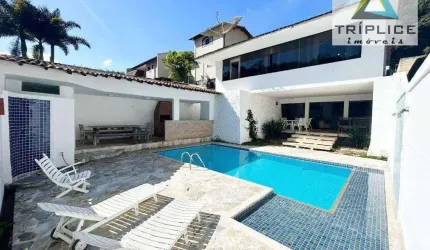 Casa duplex com 5 quartos, 2 suítes, área externa com piscina, espaço gourmet e bela vista. Localização privilegiada no bairro Vale do Ipê.