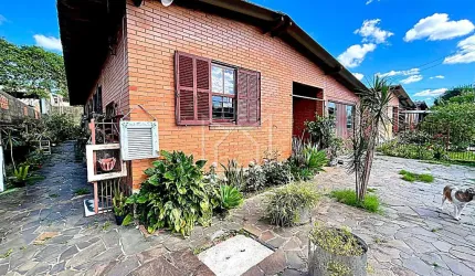 Casa com 3 quartos à venda na Rua Flávio Barros, 111, Bom Sucesso, Gravataí, 150 m2 por R$ 450.000
