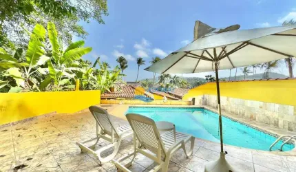 Casa com 3 dormitórios à venda, 150 m² por R$ 1.000.000,00 - Balneário Praia do Pernambuco - Guarujá/SP