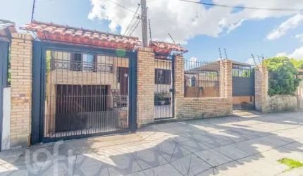 Casa com 4 quartos à venda na Rua Xavier da Cunha, 581, Nonoai, Porto Alegre, 193 m2 por R$ 689.000