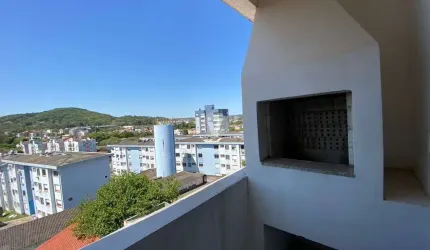 Apartamento de dois dormitórios com sacadas e vaga de garagem