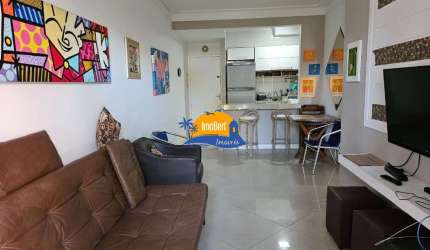 Apartamento à venda  na quadra da praia no Centro de Bertioga-SP: 2 quartos, 1 suíte, 2 salas, 2 banheiros e 70m² de área. Aproveite!