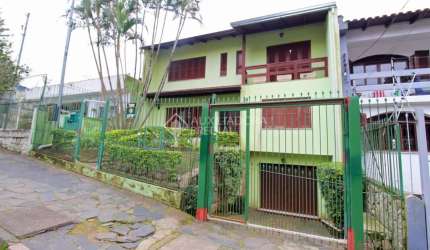 Casa com 3 quartos à venda na Rua Coronel Tisiano F. de Leoni, 305, Coronel Aparício Borges, Porto Alegre, 274 m2 por R$ 799.000