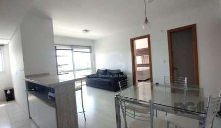 Apartamento mobiliado, 57m2, 1 suite, 1 vaga, lareira e churrasqueira, localizad