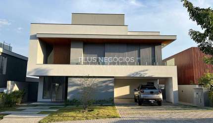 Casa nova no Alphaville 2 com 5 suítes, piscina com borda infinita e vista incrível — estuda até 10